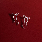 Sending Love And Wishes Bow Stud Earrings In Silver Plating